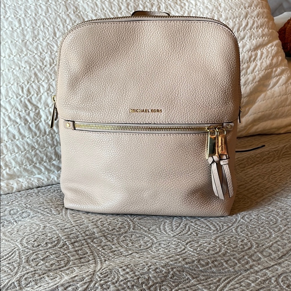 Michael Kors Light Pink Backpack with Gold Hardware and Structured Design